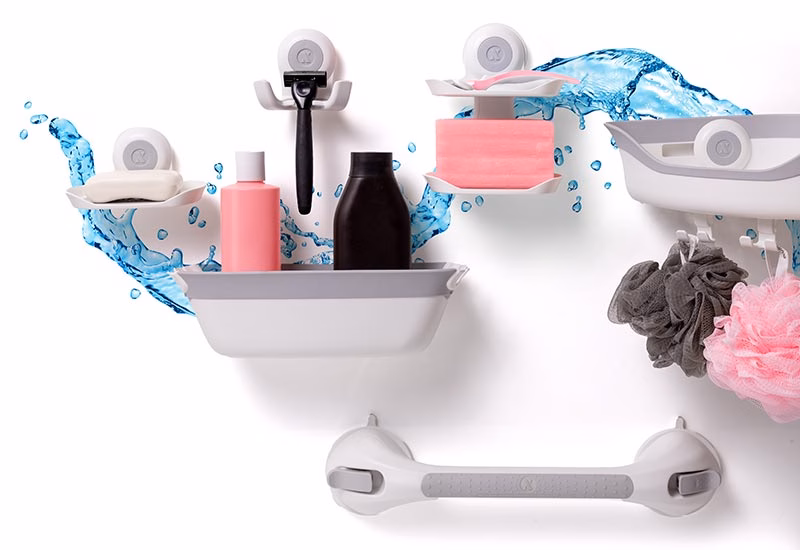 SlipX Solutions On the Dot suction cup accessories shown holding shampoo, razors, loofahs and more.