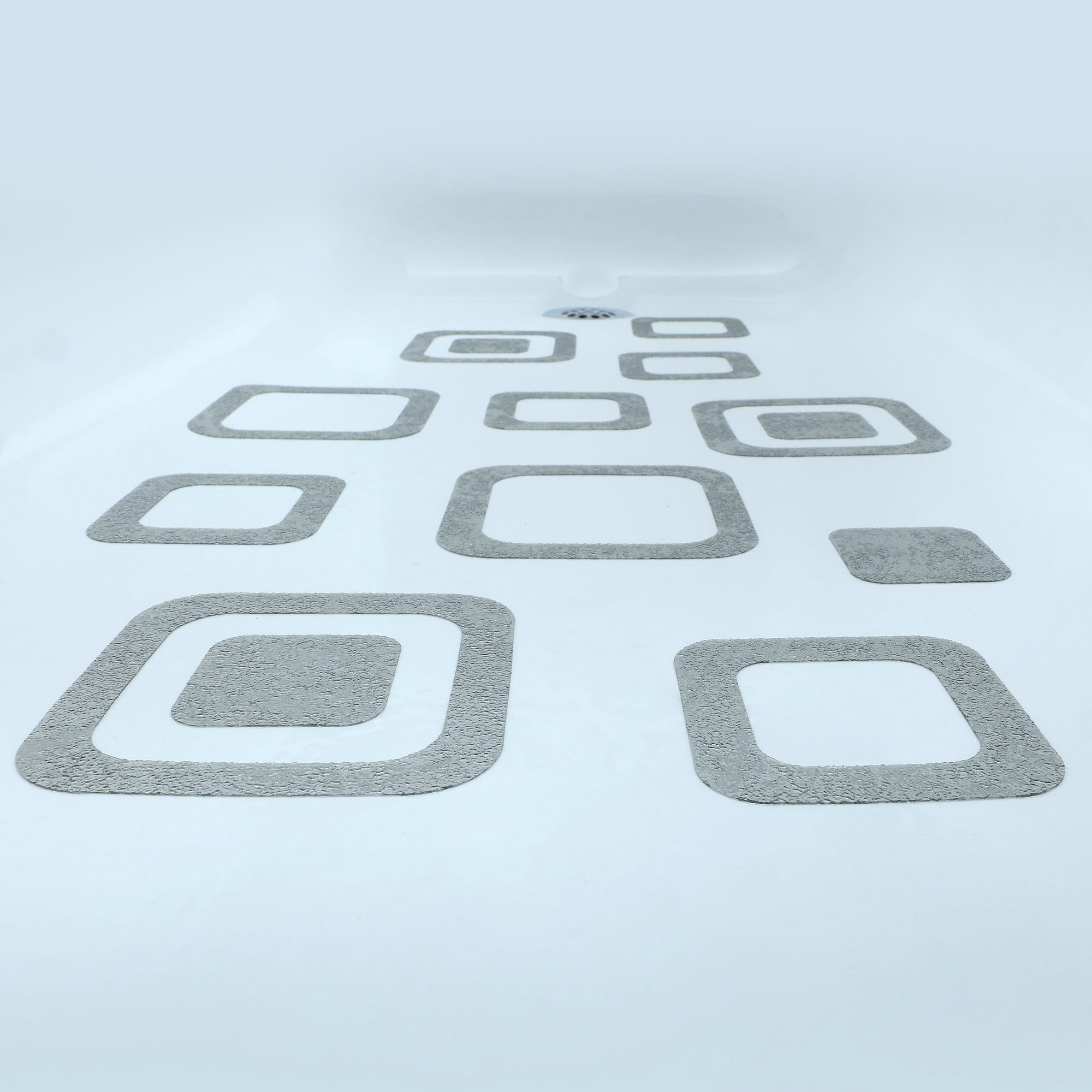 Gray non slip bathtub stickers in a bathtub