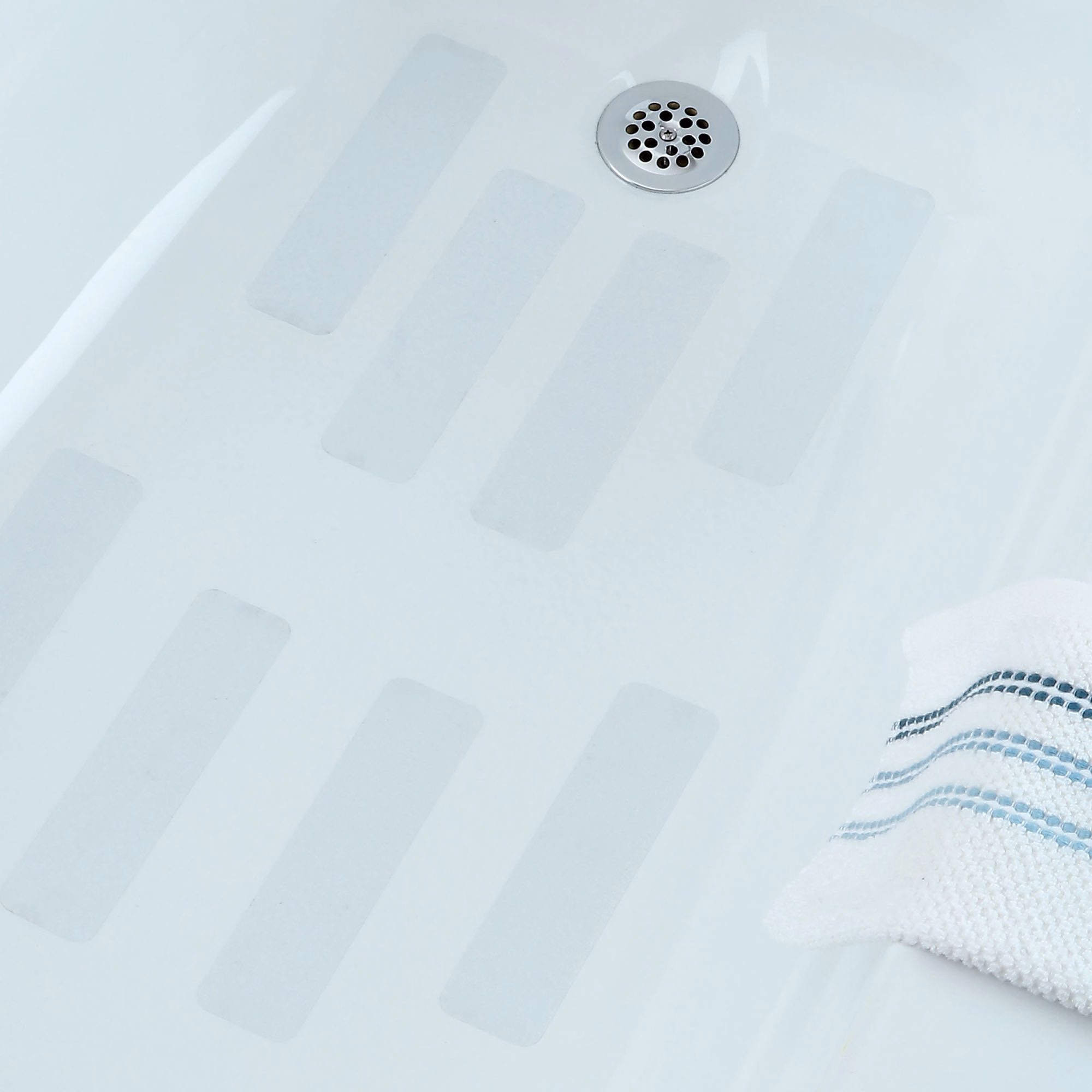 Wide clear adhesive treads in bathtub